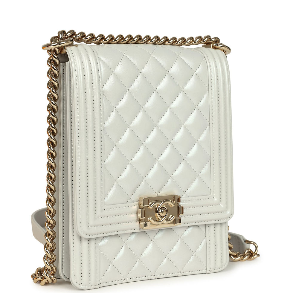 Angled view of the light grey iridescent Boy Bag with its Le Boy CC closure