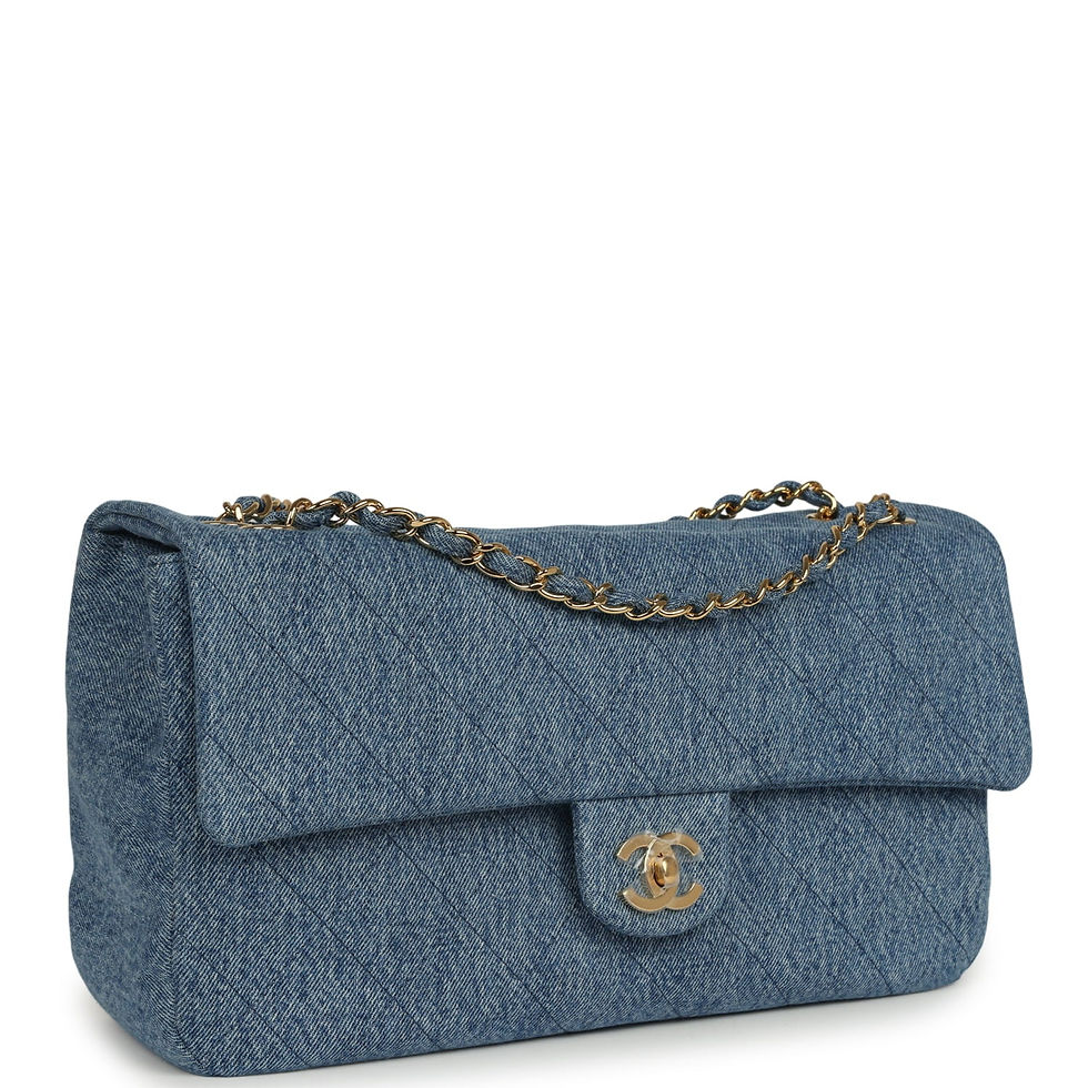 Angled front view of the small blue denim Souplissimo flap bag