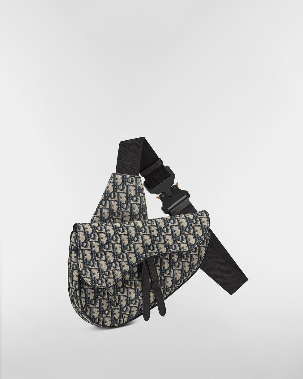 Dior Saddle bag in beige and black Dior Oblique jacquard – three-quarter view with strap