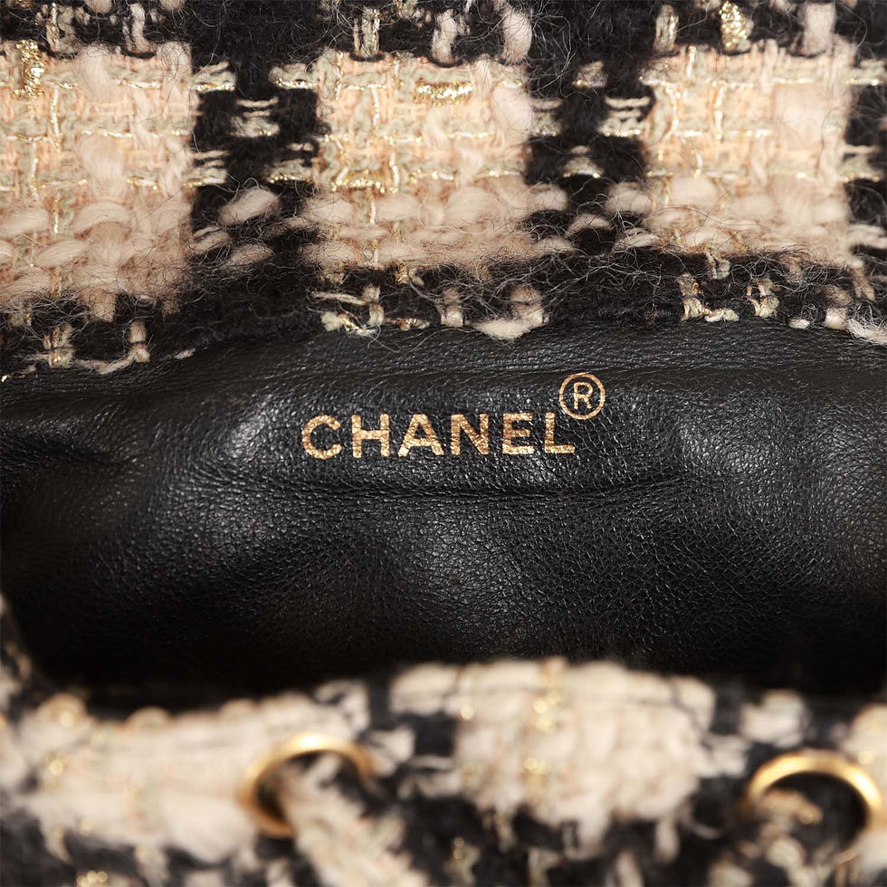Thumbnail: Close-up interior view stamped Chanel in gold foil lettering on black leather