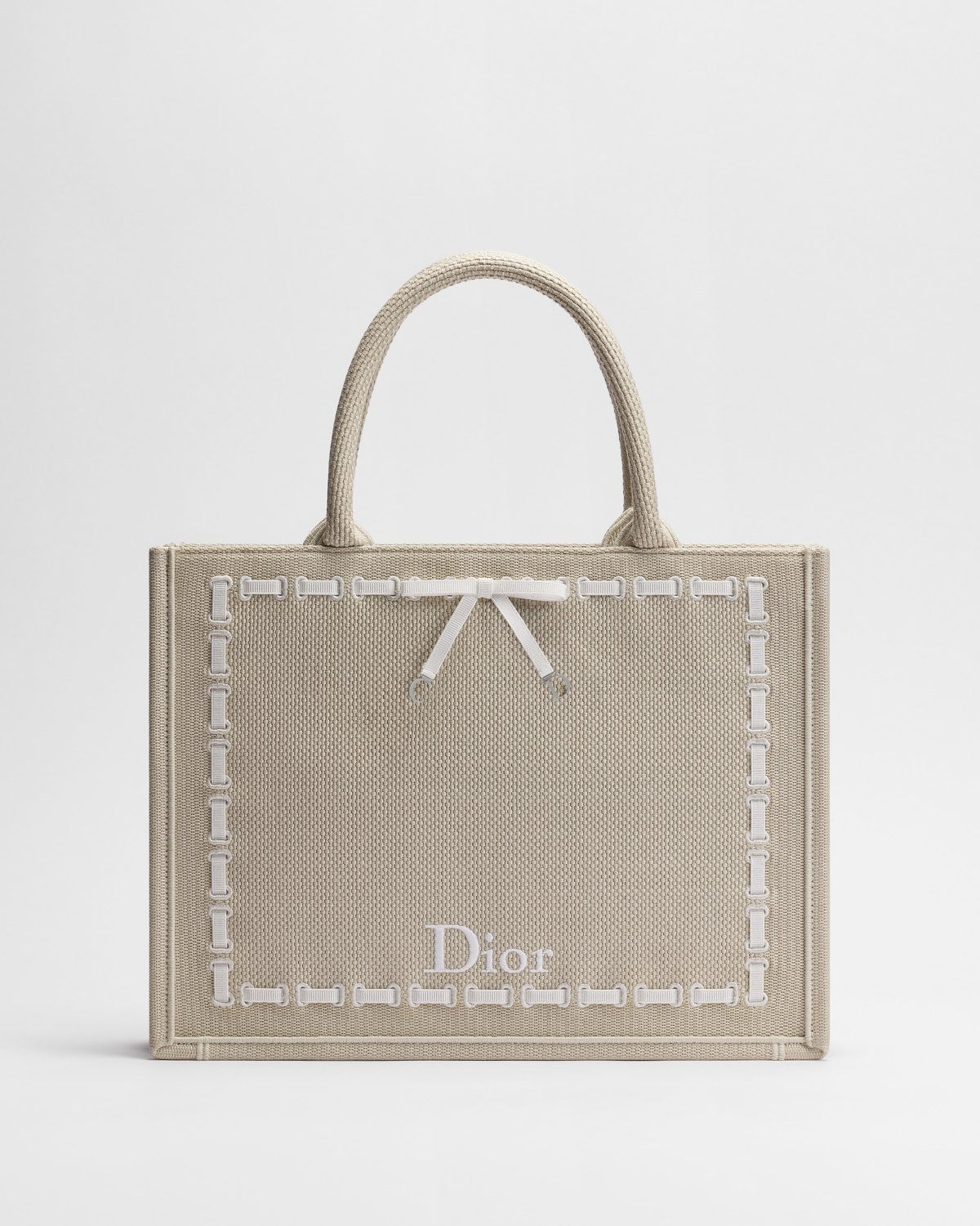 Dior Medium Book Tote with strap in beige embroidery with ribbon bow – front view