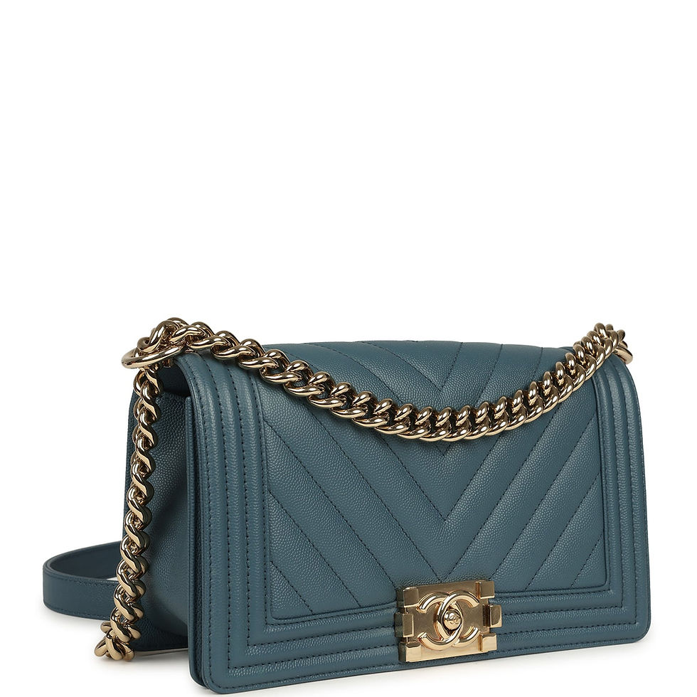 Three-quarter view of the blue chevron Boy Bag showing the quilted flap and CC push-lock clasp