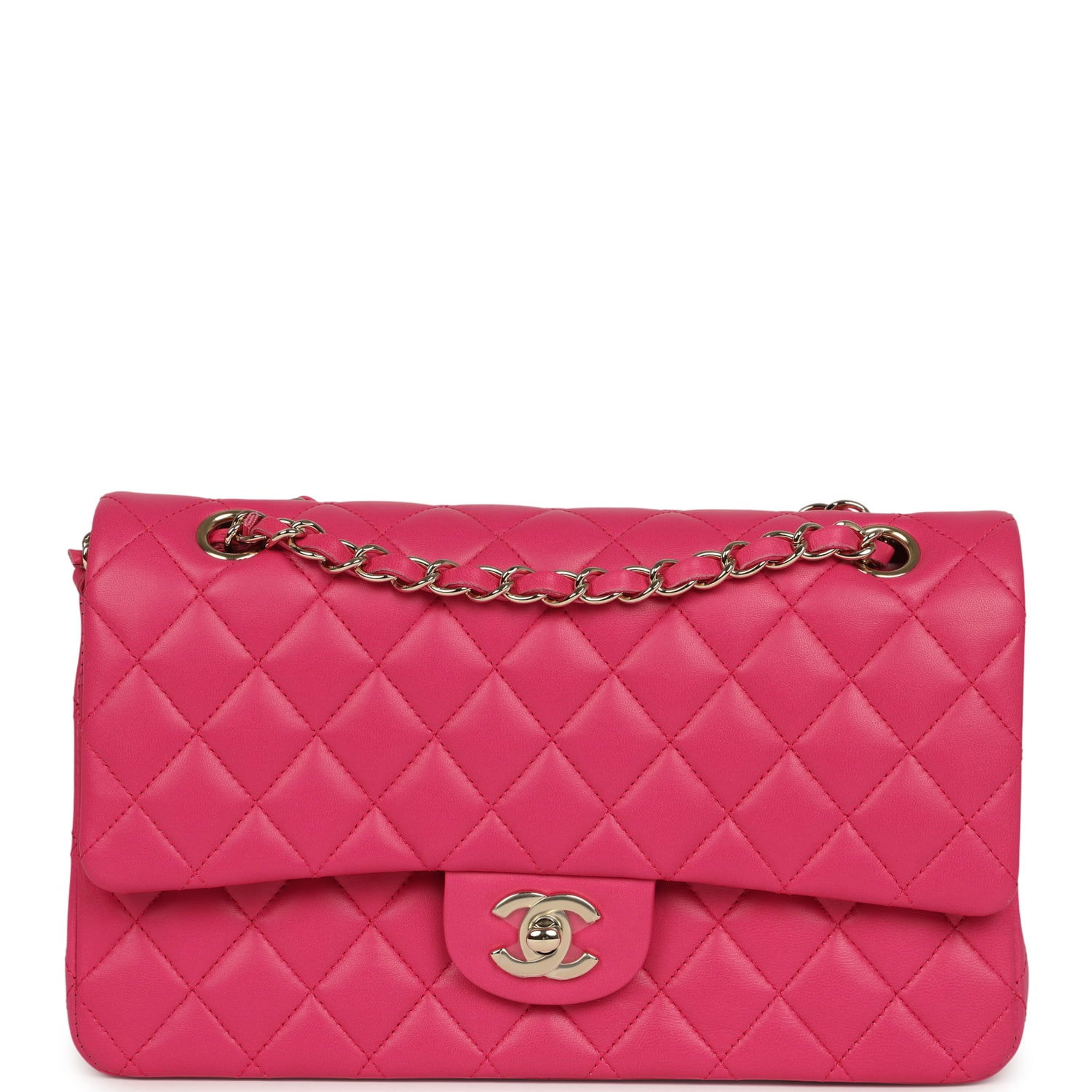 Front view of the fuchsia pink lambskin Chanel Medium double flap with gold hardware