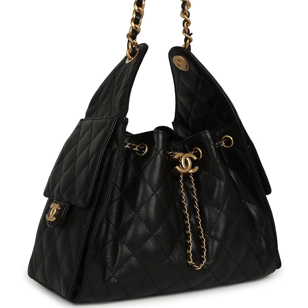 Three-quarter view of the black caviar hobo bag showing the side flap pocket and chain strap