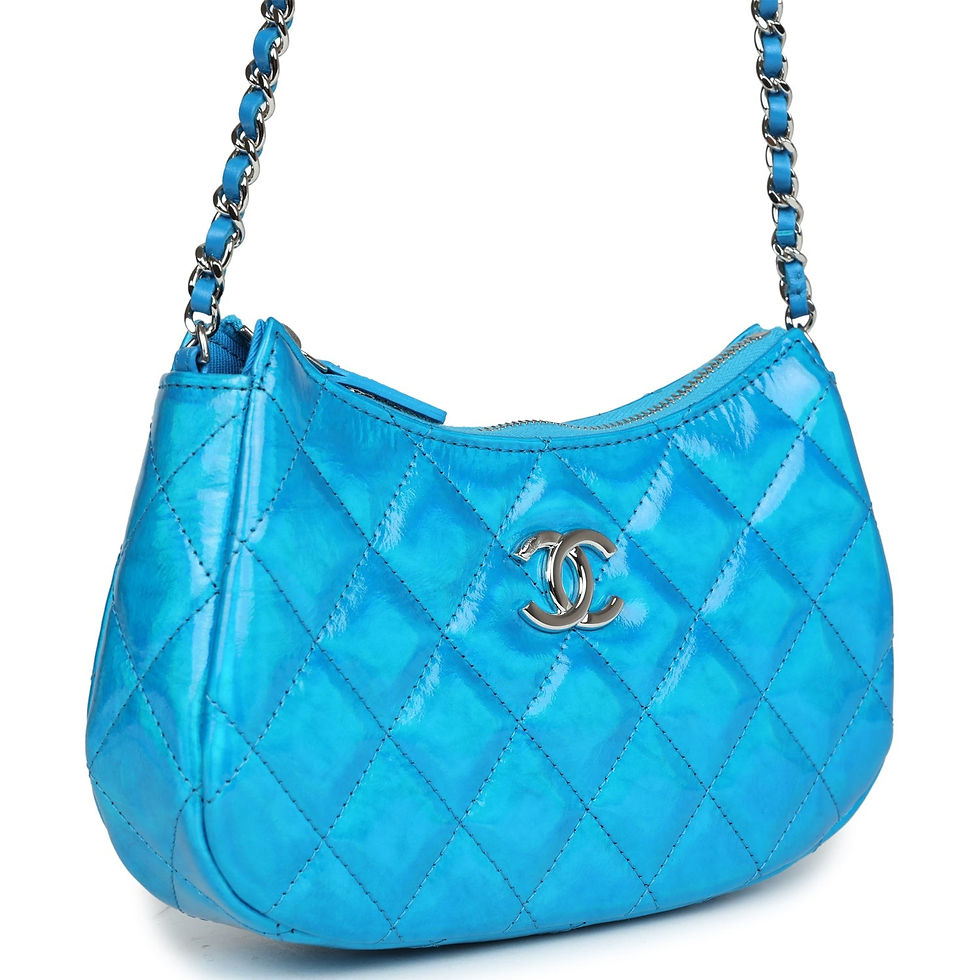 Three-quarter angled view of the turquoise hobo bag showing the diamond quilting