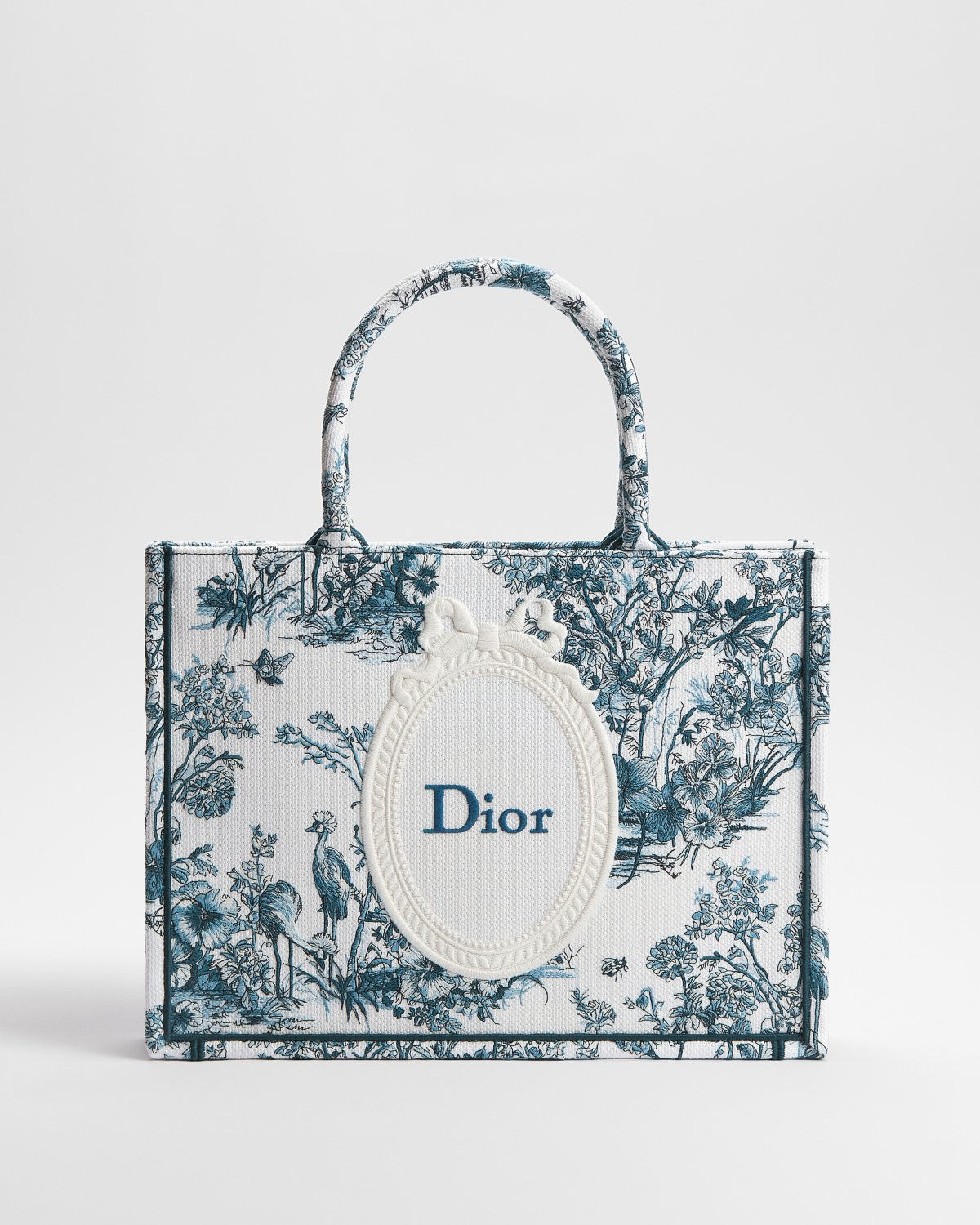 Dior Medium Book Tote in blue cotton with Toile de Jouy Floral Garden embroidery – front view