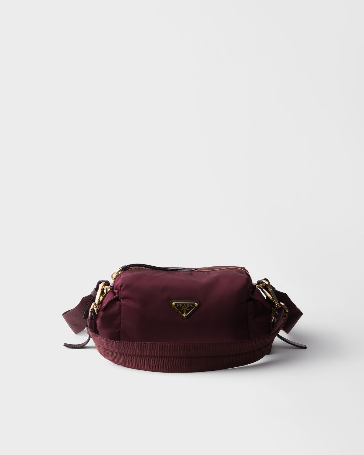 Prada Explore small bag in burgundy Re-Nylon and leather – front view