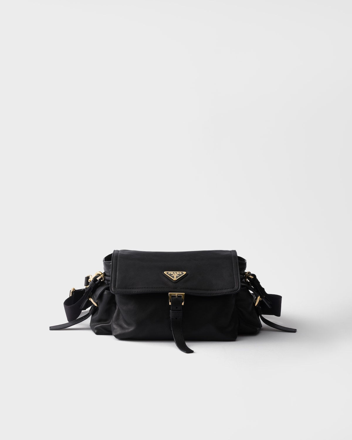 Prada Explore medium shoulder bag with flap in black nappa leather – front view