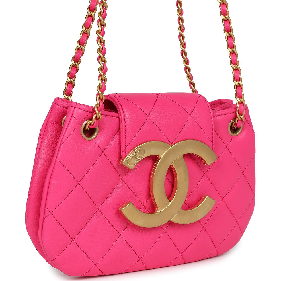 Three-quarter view of the fuchsia mini shoulder bag showing the double chain strap