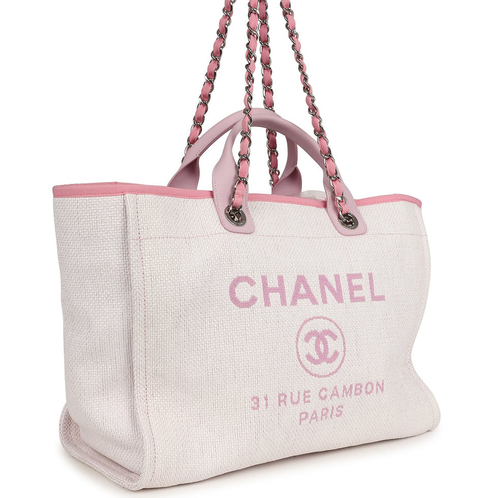Angled view showing the beaded Chanel Paris logo on the raffia canvas panel