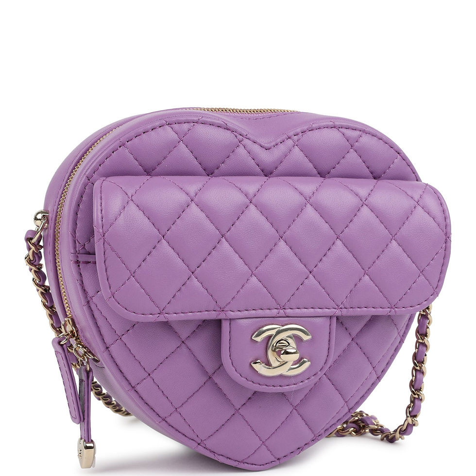 Three-quarter view of the purple heart bag showing the zip-top opening and chain strap