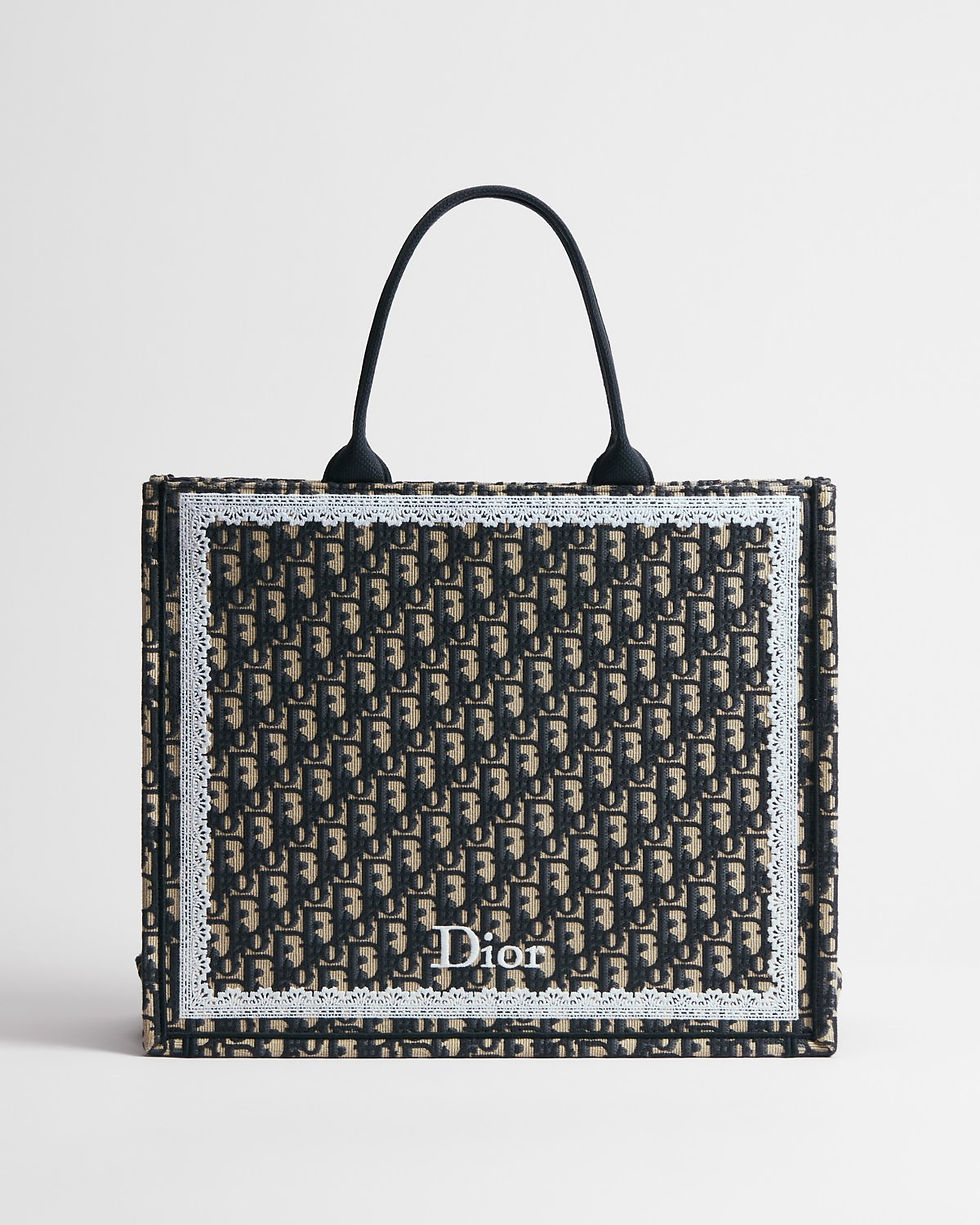 Dior Large Book Tote in blue Dior Oblique embroidery with lace frame and bow – front view