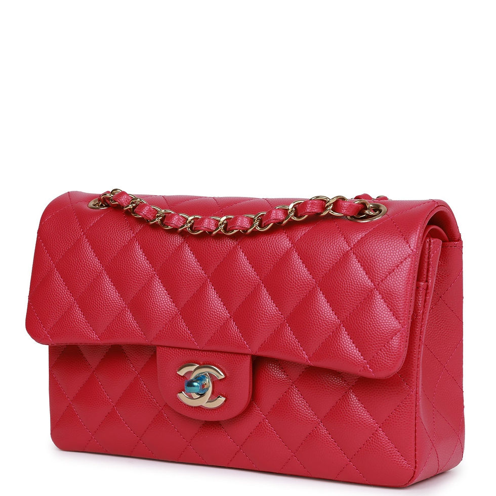 Thumbnail: Three-quarter front view of the fuchsia Chanel Small Classic Flap with chain strap draped over the flap