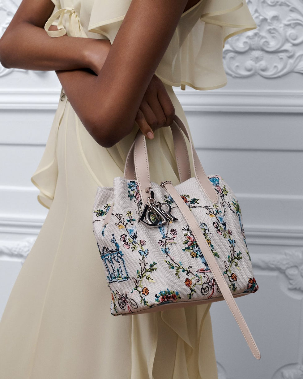Thumbnail: Dior Dioriviera Small Toujours Vertical Tote in multicolor Dior Arabesque embroidery – carried by model