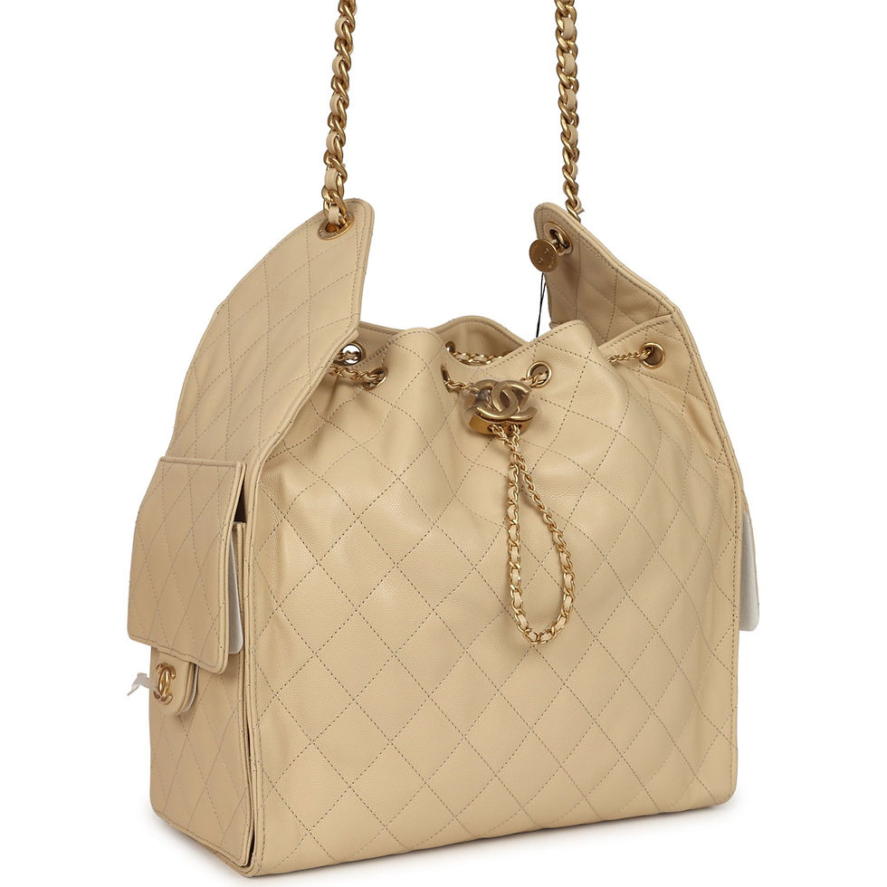 Angled view of the beige caviar hobo bag showing a side flap pocket with CC turnlock