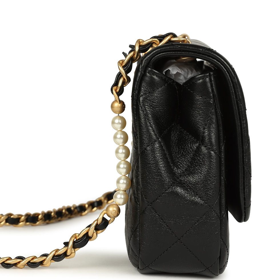Thumbnail: Side profile of the black calfskin flap bag with the pearl-beaded chain along the gusset