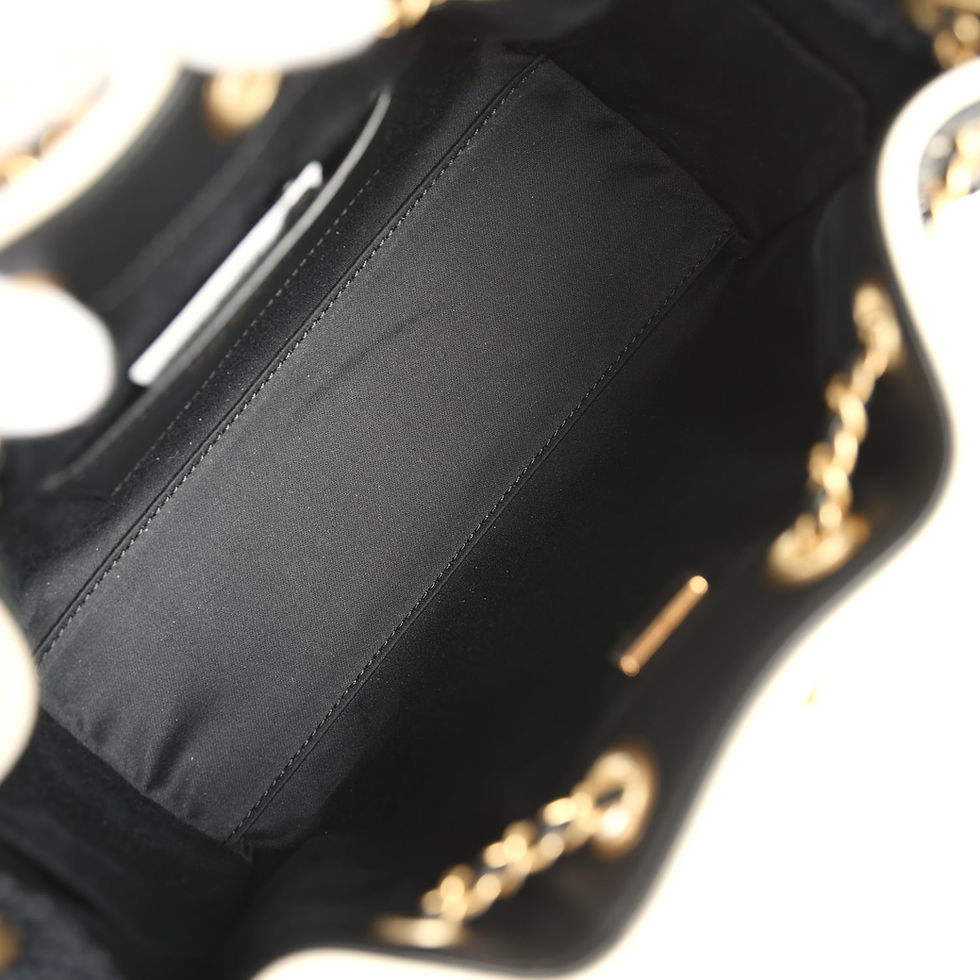Thumbnail: Interior view of the raffia hobo bag showing the black fabric lining and slip pocket
