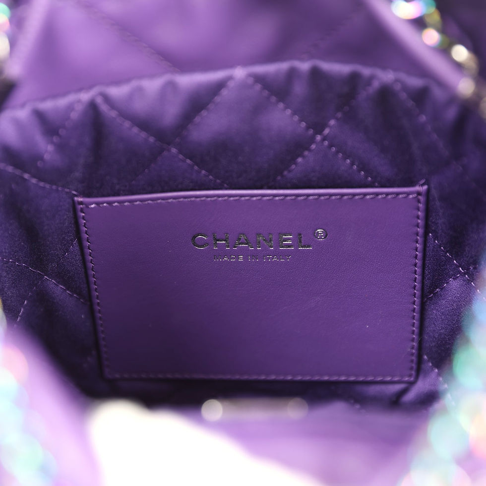 Thumbnail: Close-up of the Chanel Made in Italy stamp on the purple leather interior tab
