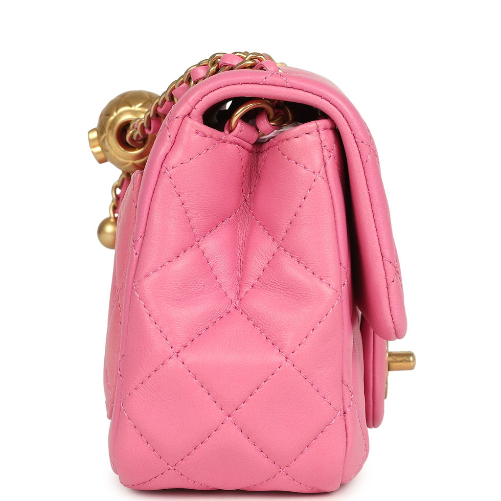 Thumbnail: Side view of the pink lambskin flap bag with the quilted gold sphere charm on the chain