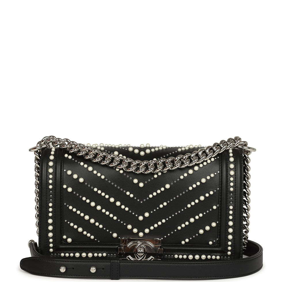 Front view of the Chanel Medium Boy bag in black calfskin with pearl chevron detailing