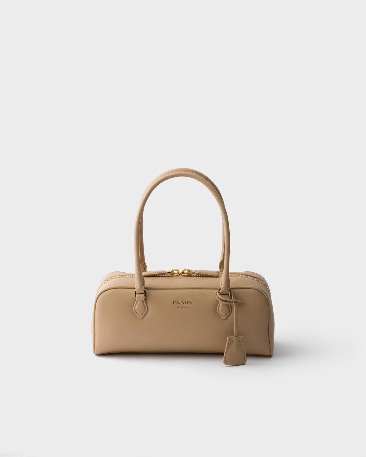 Prada medium top-handle bag in sand beige leather – front view