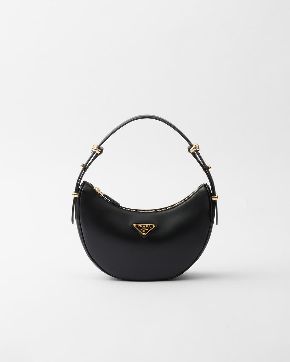 Prada Arqué small shoulder bag in black leather – front view