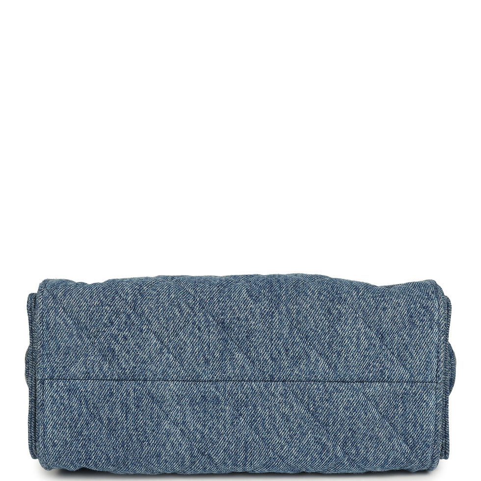 Thumbnail: Base of the blue washed denim hobo bag showing its structured, quilted underside