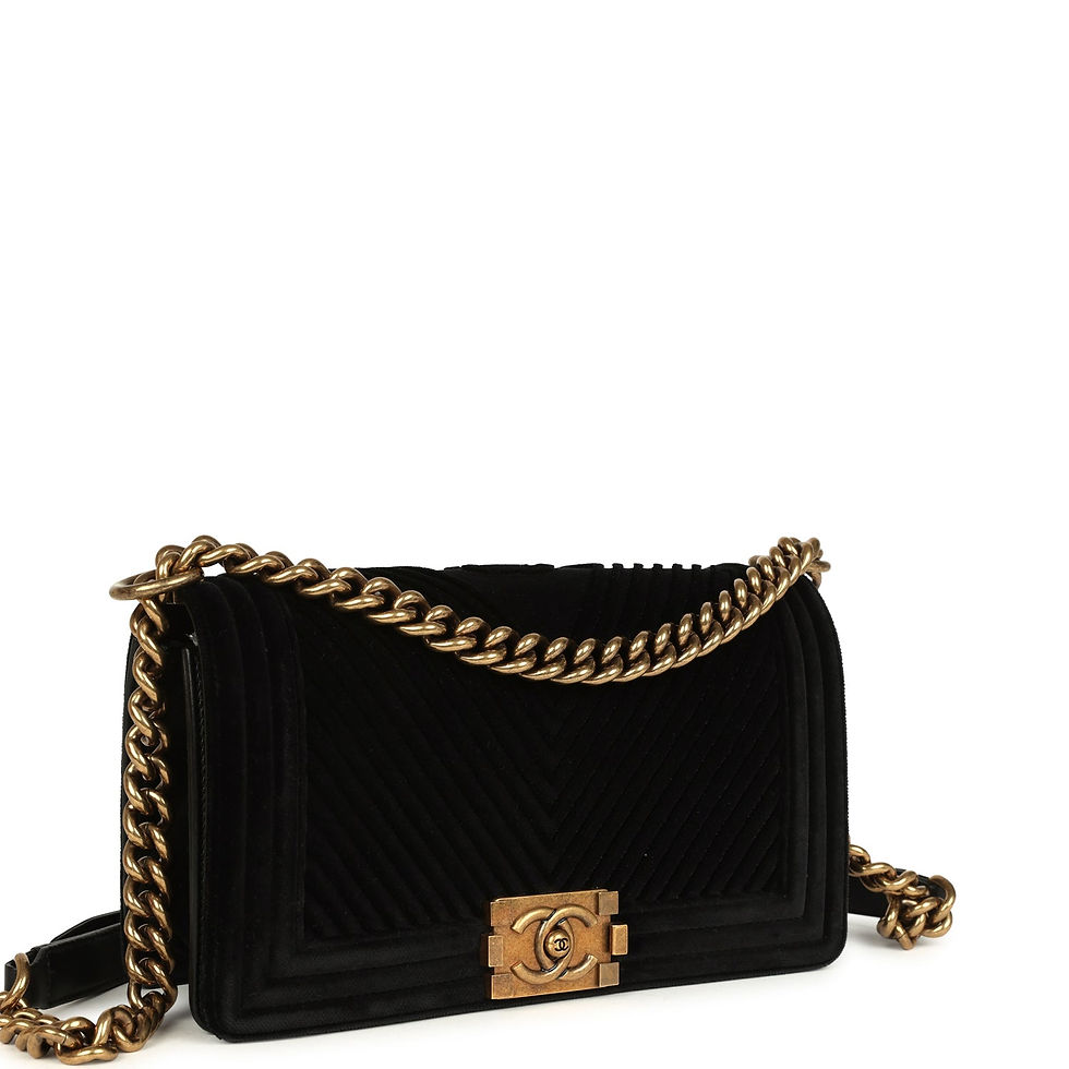 Three-quarter view of the black velvet Boy Bag showing the chevron quilting and CC push-lock clasp