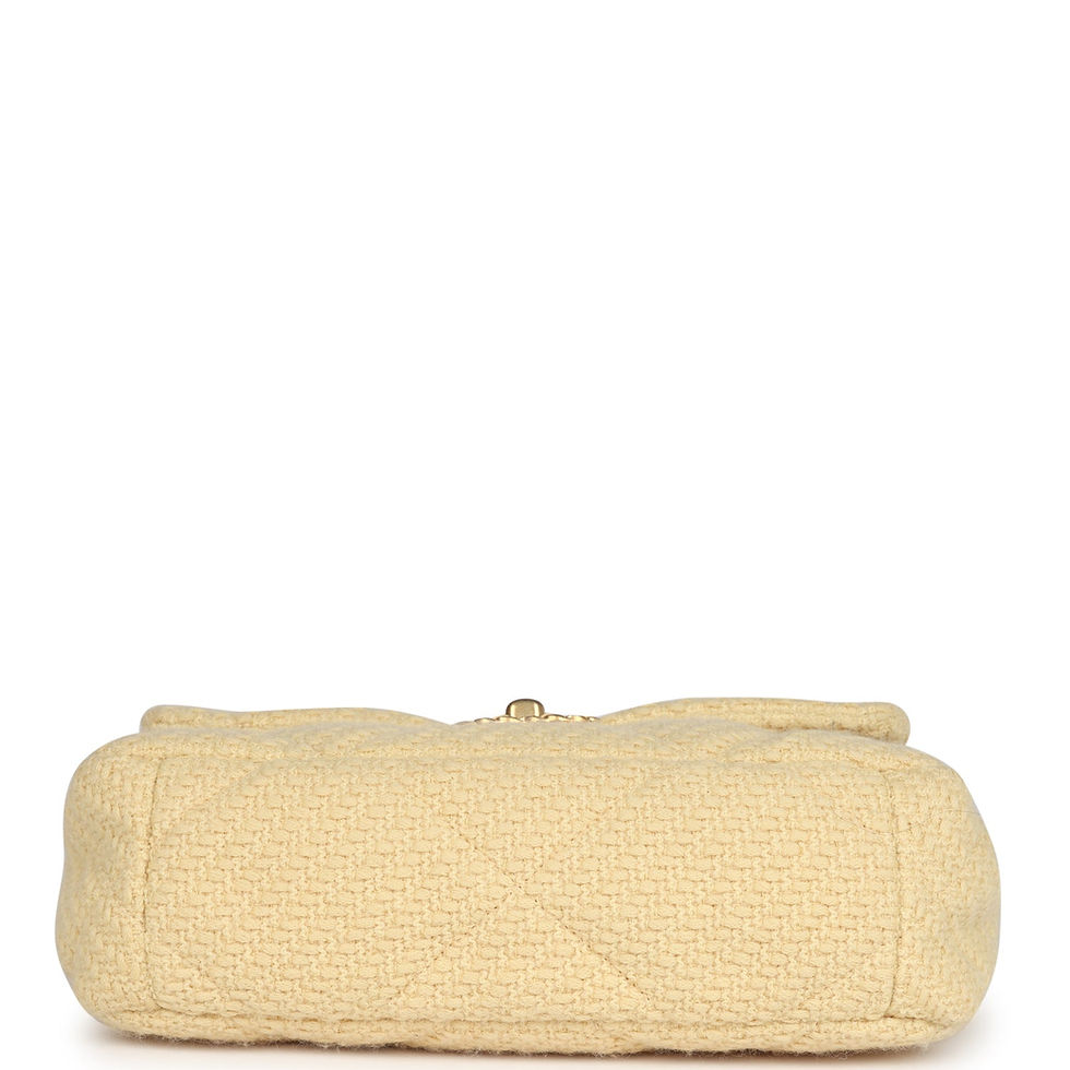 Thumbnail: Underside of the light yellow wool tweed flap bag showing the leather-trimmed base