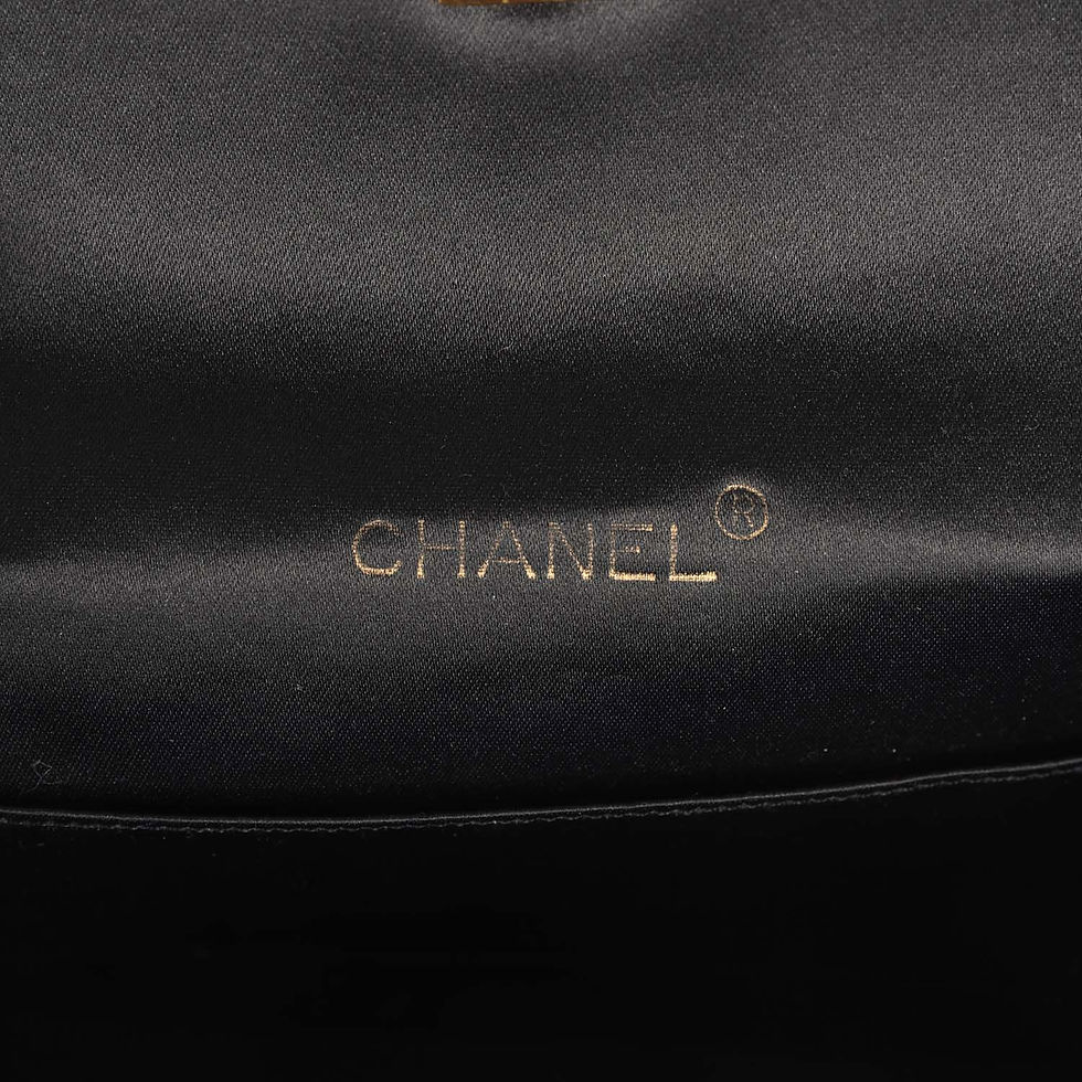 Thumbnail: Close-up interior view stamped Chanel in gold foil lettering on black satin