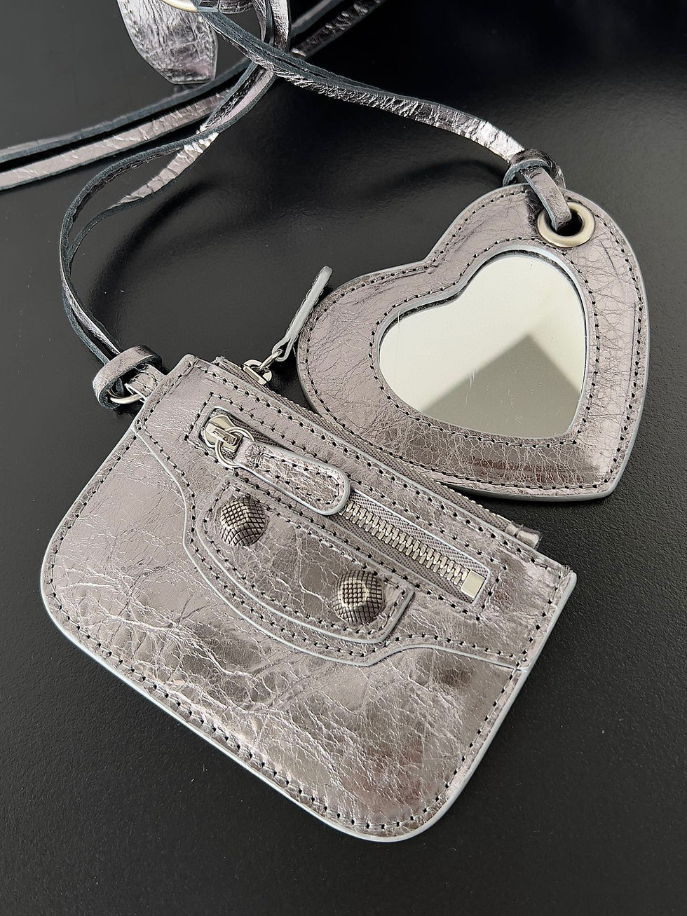 Top view of the silver Balenciaga Le Cagole XS bag with heart mirror