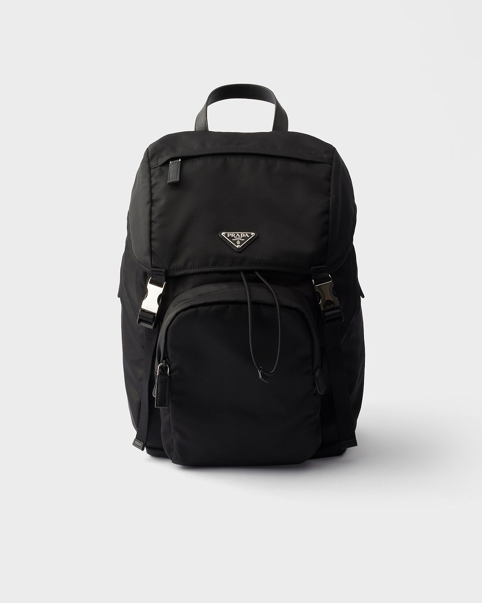 Prada flap backpack with front pocket in black Re-Nylon and Saffiano leather – front view