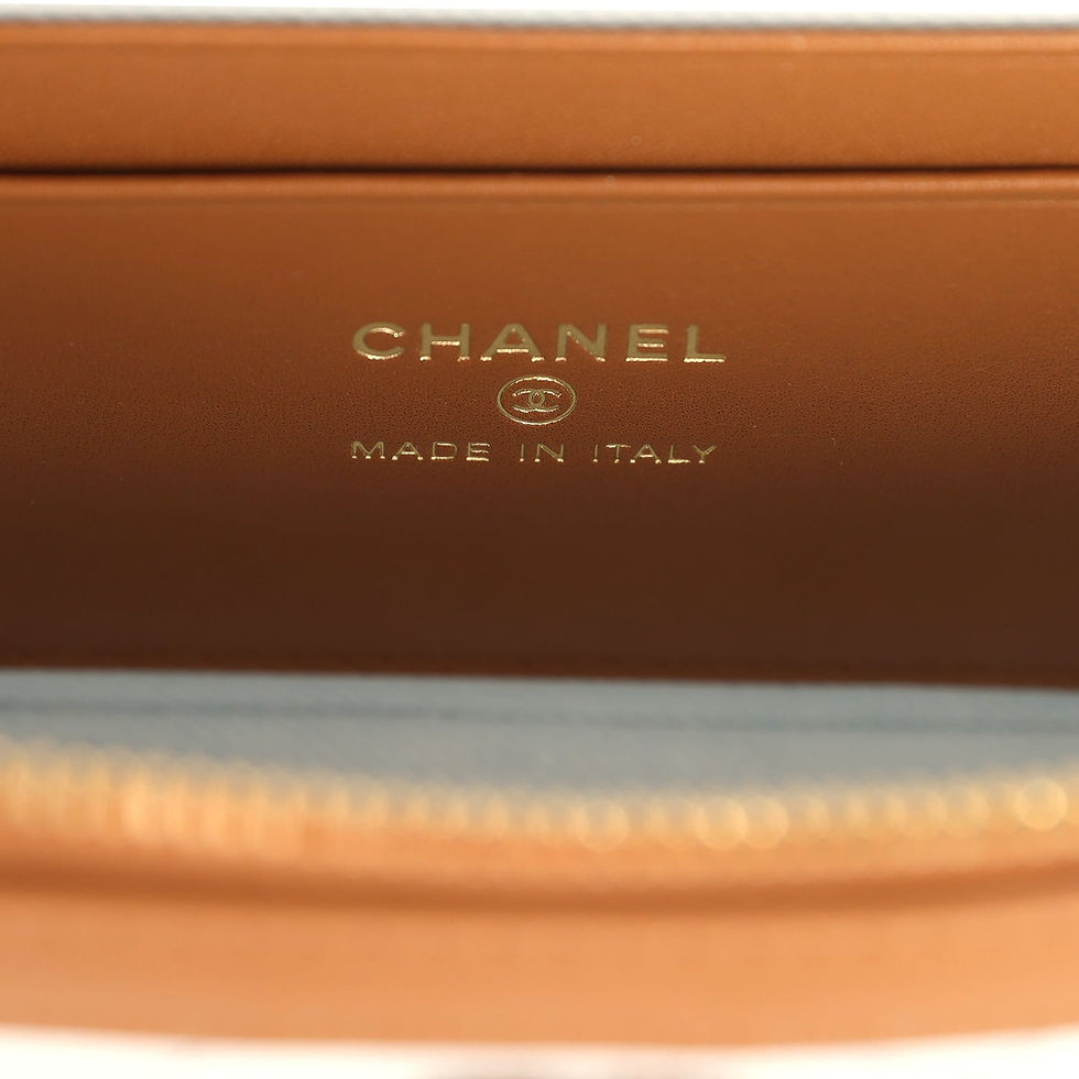 Thumbnail: Close-up of the Chanel Made in Italy stamp on the tan leather interior trim