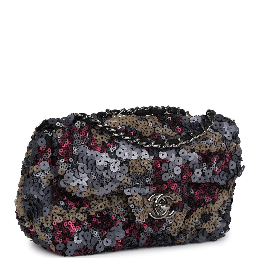 Three-quarter angled view showing the dense sequin embroidery and dark chain-and-leather strap