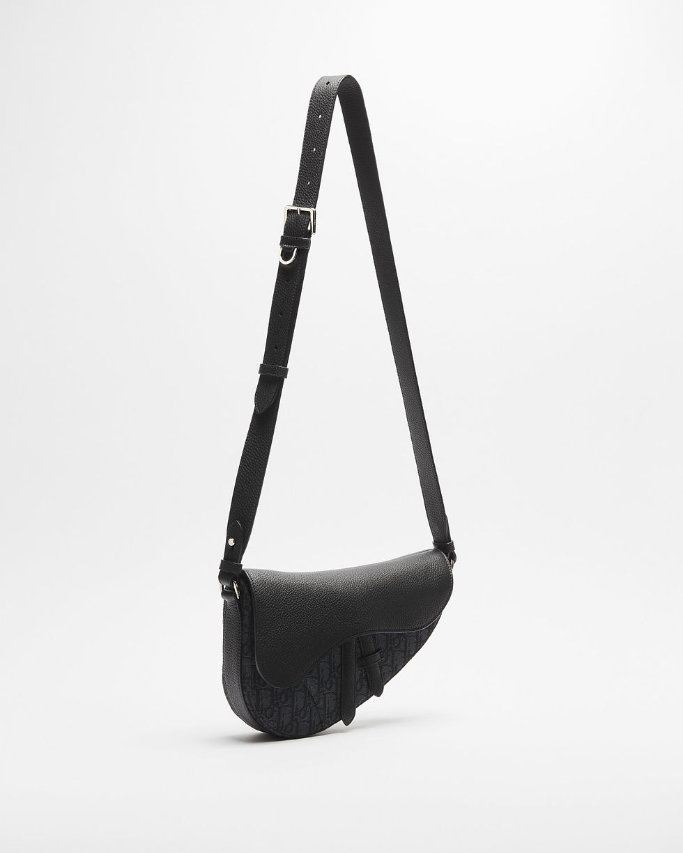 Thumbnail: Dior Saddle bag in black Dior Oblique jacquard and Taurillon leather – side view with full strap