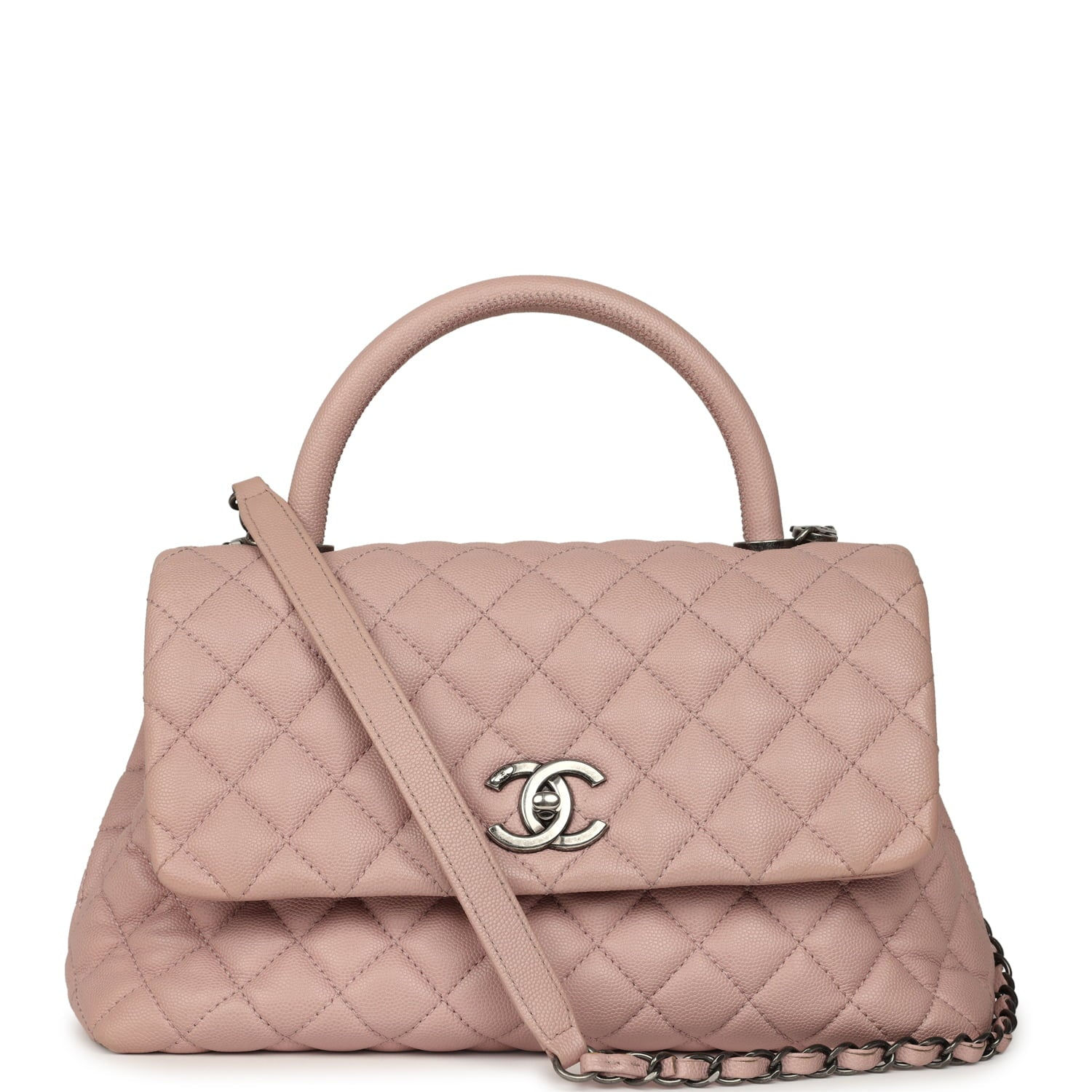 Front view of a blush caviar Chanel Coco Handle bag with aged ruthenium turnlock