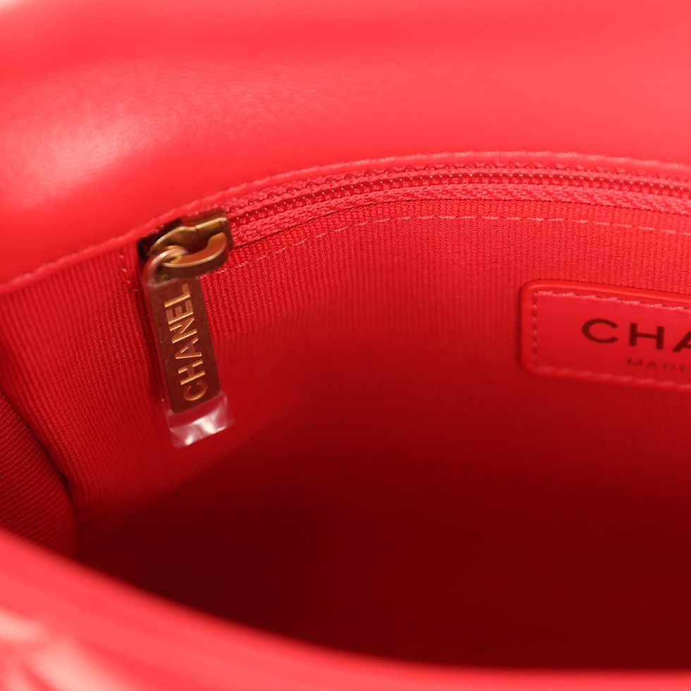Thumbnail: Interior zip pocket detail with gold-tone zipper pull against the red lining