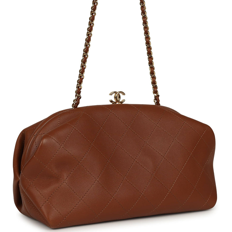Angled front view of Chanel camel lambskin clutch showing gold CC clasp