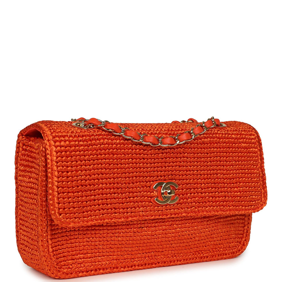 Angled front view of Chanel orange raffia flap bag showing gold CC clasp