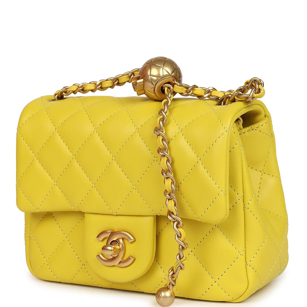 Thumbnail: Angled front view of the yellow lambskin bag highlighting the CC turn-lock clasp
