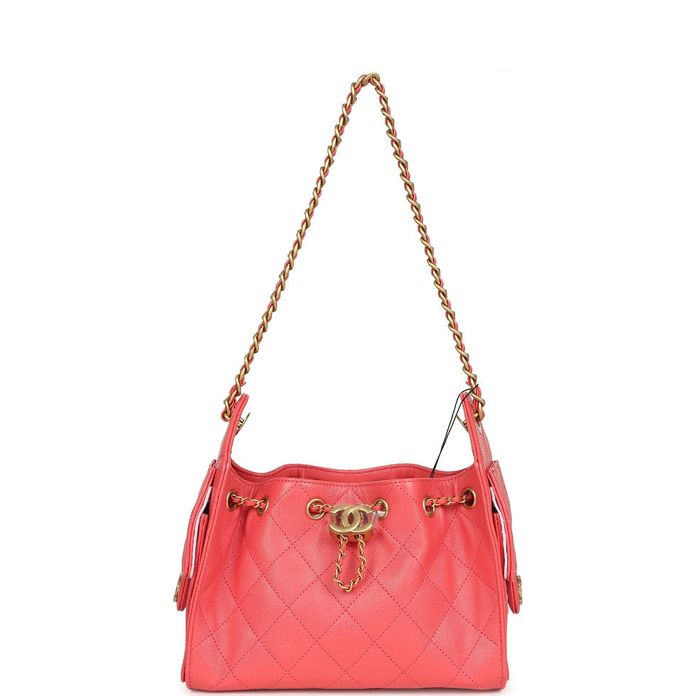Thumbnail: Base of the coral pink caviar hobo bag showing its structured, quilted underside