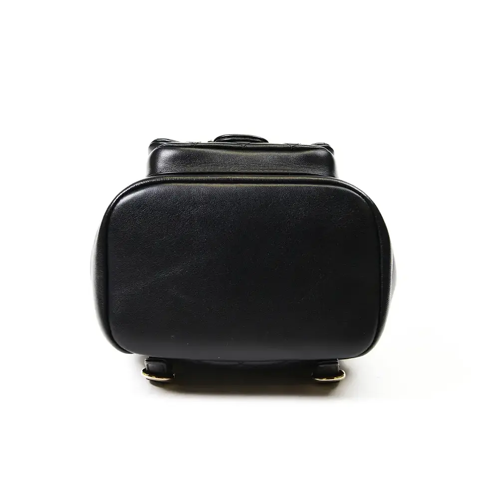 Thumbnail: Side profile of the quilted black lambskin Duma backpack showing its rounded shape
