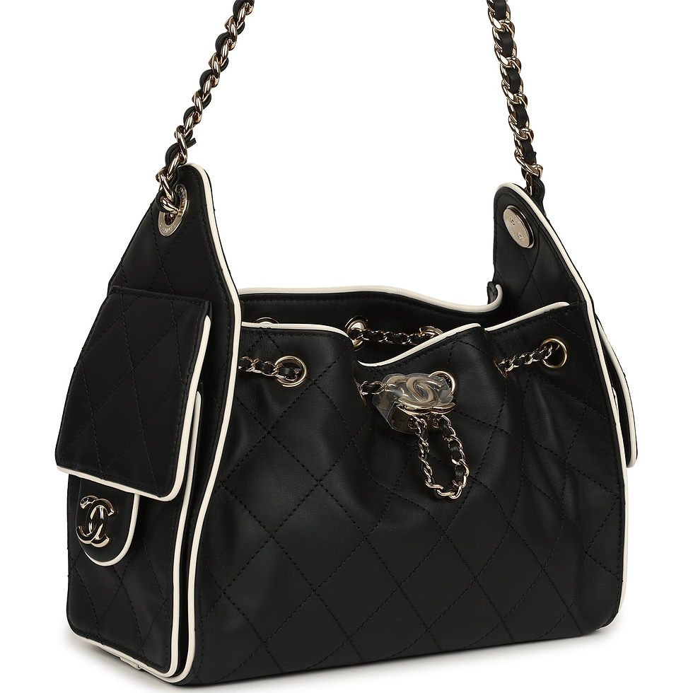 Angled view of the black and white hobo bag showing the side flap pocket and CC turnlock