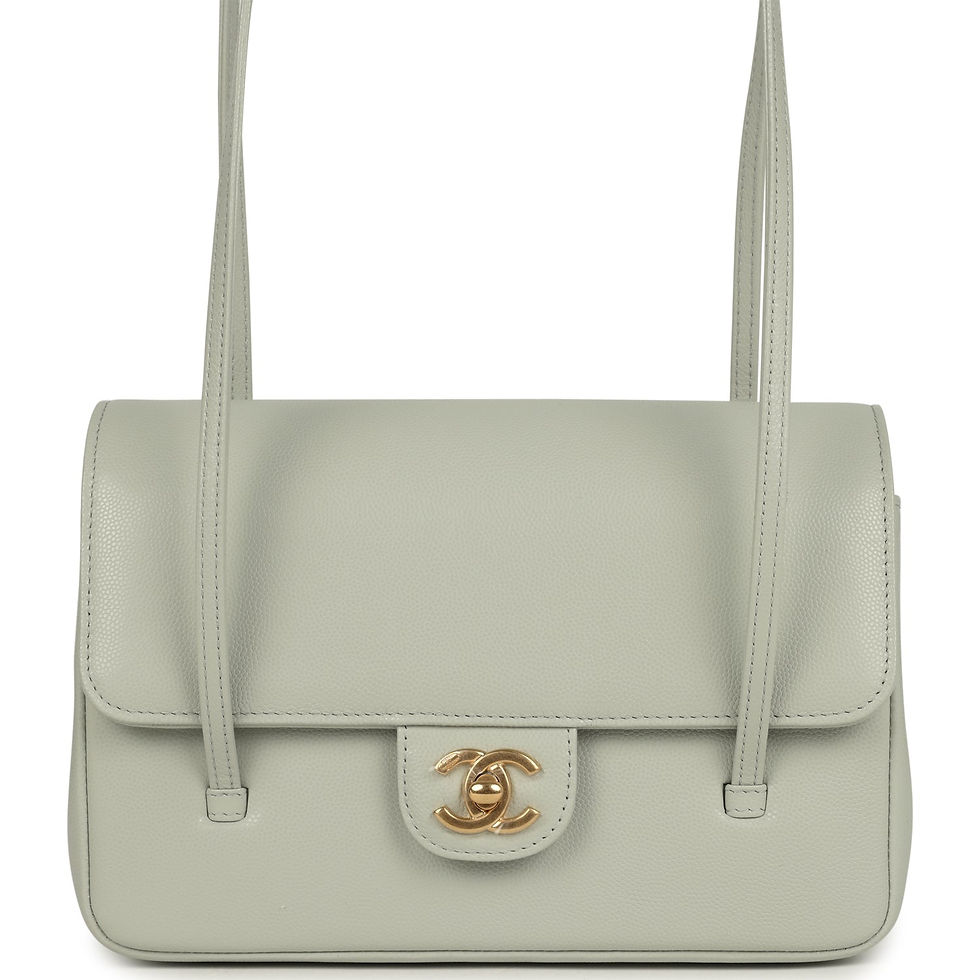 Front view of a pale sage green caviar Chanel flap bag with brushed gold turnlock and long straps