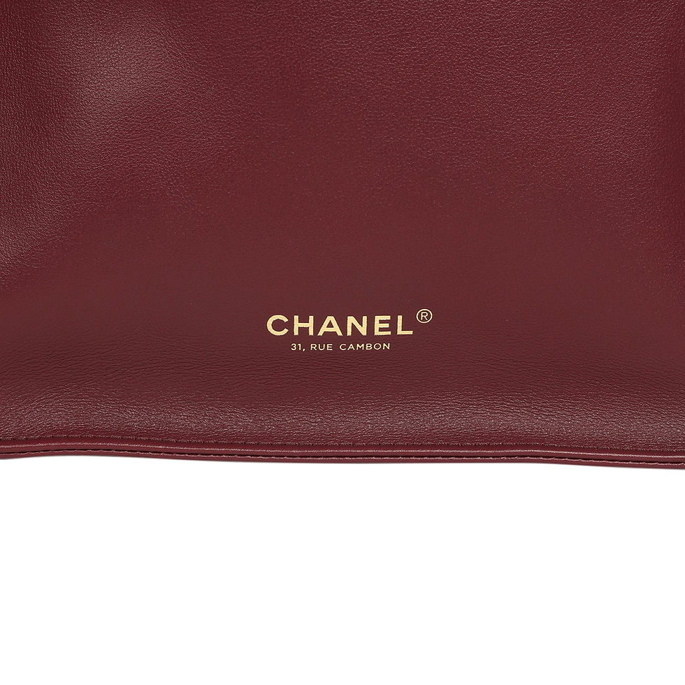 Thumbnail: Close-up of the gold-foil Chanel 31 Rue Cambon signature stamped at the base