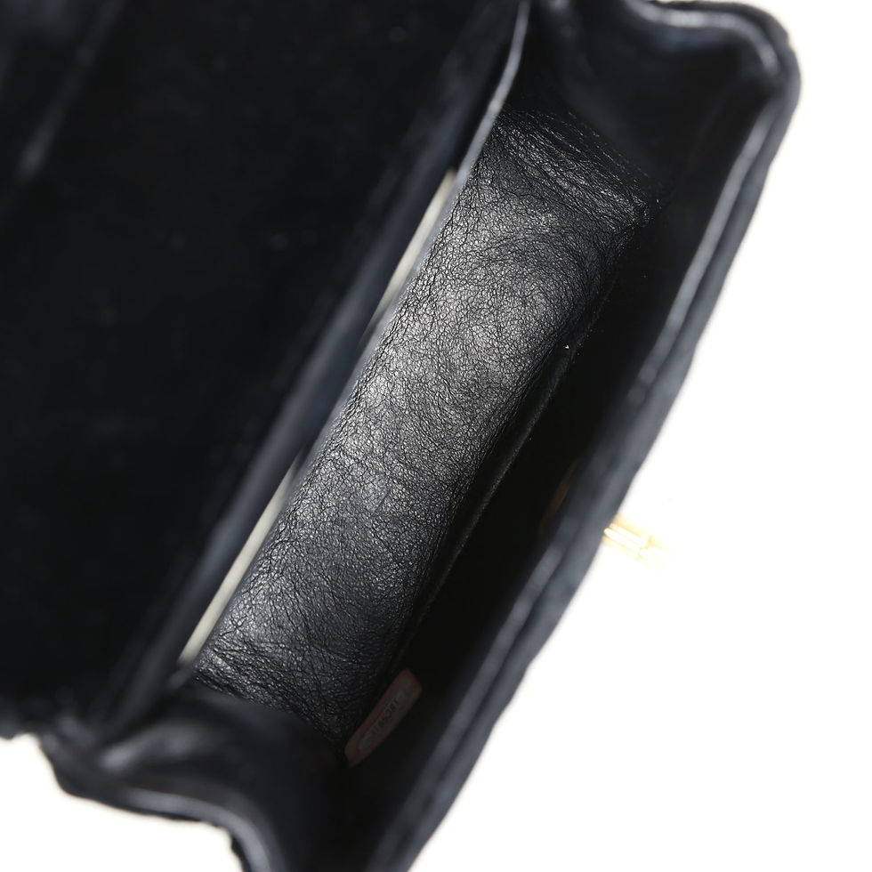 Thumbnail: Interior view of the black velvet vintage Chanel bag showing the leather lining