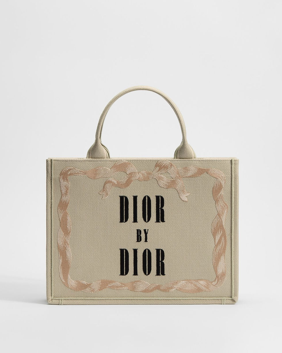 Dior Medium Book Tote in beige cotton with Dior by Dior book cover – front view