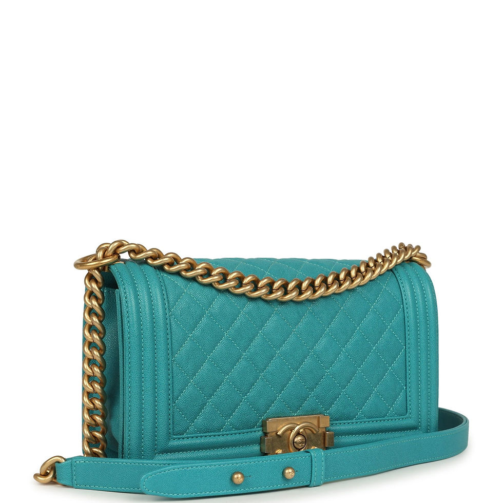 Three-quarter view of the turquoise caviar Boy Bag showing the quilted flap and CC push-lock clasp