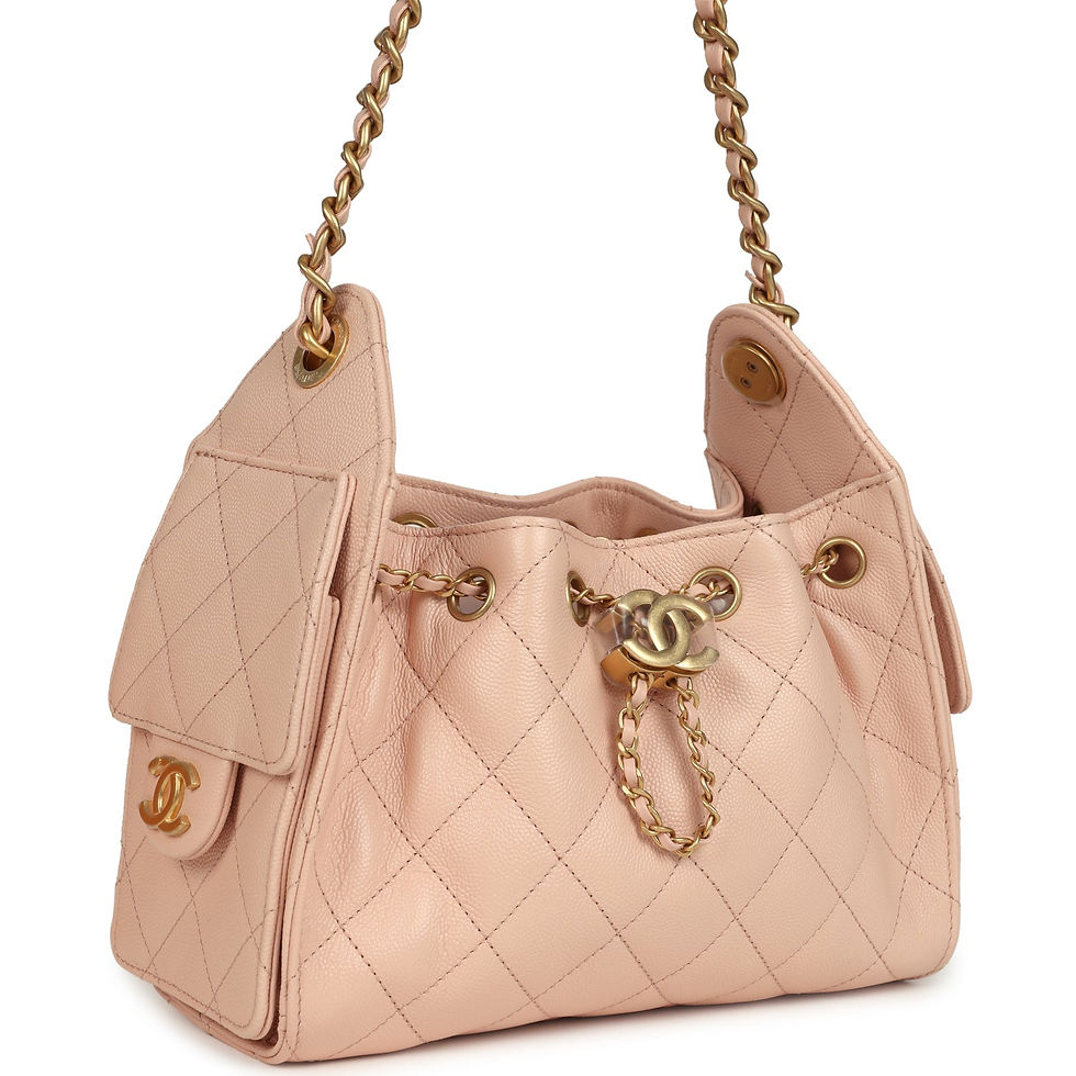Three-quarter view of the dusty pink caviar hobo bag showing the quilted side flap pocket