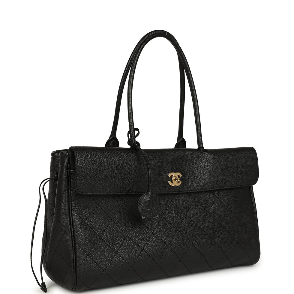 Three-quarter view of the tote showing the side drawstring gather and chain strap